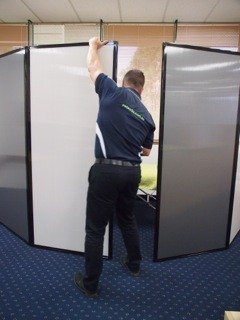 Freestanding privacy screen used to create mobile osteopath clinics in seconds