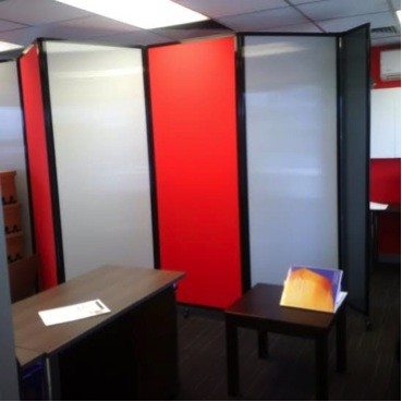 Custom office partitions wearing corporate colours